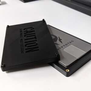 Open The Tomb Bitcoin seed plate holder with a CRYPTOTAG metal backup inside