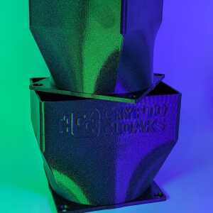 Two dark tapered shrouds stacked vertically under green and blue lighting, with CryptoCloaks branding on the lower one.