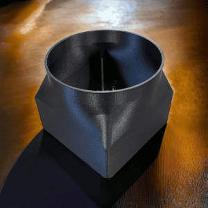 Black shroud with an open circular collar and angular lower body, viewed from above.