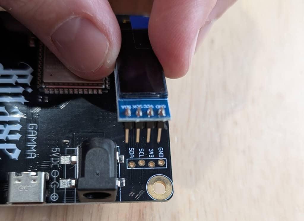 Lining up the screen pins on the Bitaxe board