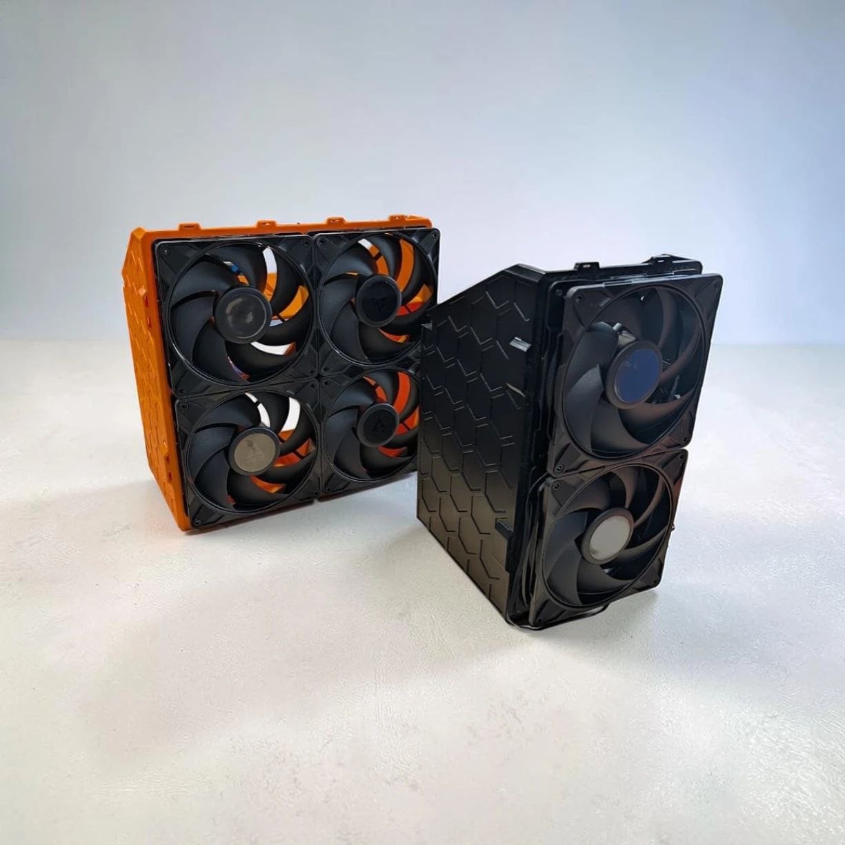 Orange 4-unit and black 2-unit Canaan Nano cooler boxes with 140mm fans
