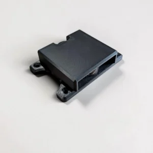 Black CryptoCloaks Bitkey Mount holding a second-generation screen-equipped Bitkey hardware device with screw mounting tabs visible