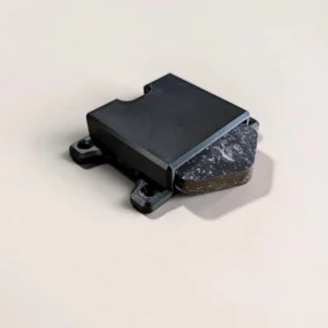 Black CryptoCloaks Bitkey Mount with the second-generation screen-equipped Bitkey partially sliding out to show the holder opening and device fit
