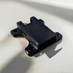 Empty black Jade Plus hardware wallet mount with rectangular opening and four screw mounting tabs